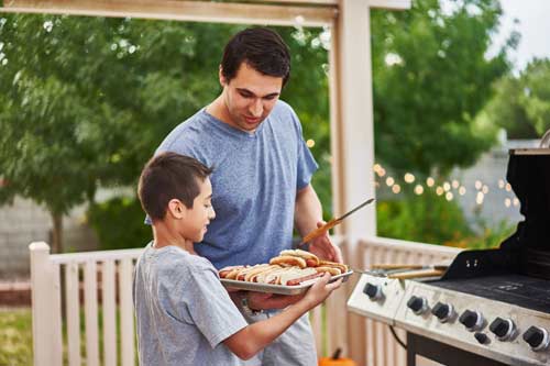 father and son grilling