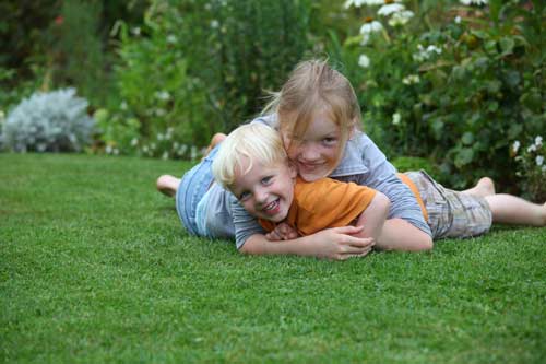 brother and sister in yard